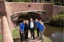 BRIDGE RESTORED: Stephen Rose, centre with, from left, John Dunkley, Keith Bradfield, Mike Latham and Neil Paskin of the Canal and River Trust.