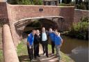 BRIDGE RESTORED: Stephen Rose, centre with, from left, John Dunkley, Keith Bradfield, Mike Latham and Neil Paskin of the Canal and River Trust.