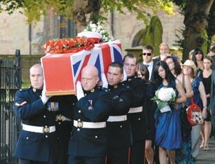 Royal Marines carried the coffin out of St John the Baptist Church followed by the family of Jonathan Crookes. (Buy photo: 331041M)