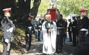 Royal Marines flank the coffin as it arrives at the church.(Buy photo: 331047M).