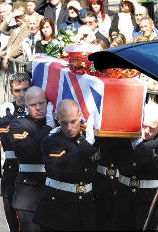 Royal Marine pallbearers carry the coffin into the church. (Buy photo: 331048M).