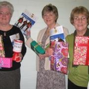 L-R: Margaret Parton, Celia Wilkie and Chris Johnson with the Mother’s Day gifts on sale.