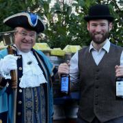 AWARD WINNERS: Jim Davis, founder of Hobsons, celebrate the Old Henry and Town Crier bottles picking up gold and bronze medals at the CAMRA West Midlands Beer of the Year competition with Tim Sant.