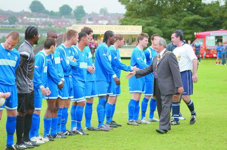 Dudley mayor councillor Ray Burston and Super Bob Taylor meet the Halesowen Town squad.