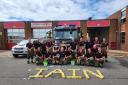 Firefighters at the charity car wash at Brierley Hill Fire Station held in honour of missing crew manager Iain Hughes