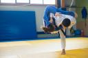 Photo by Kampus Production: https:a judoka throwing an opponent to the ground