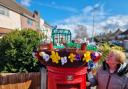 The post box topper being admired