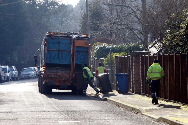 Bin men with a waste lorry