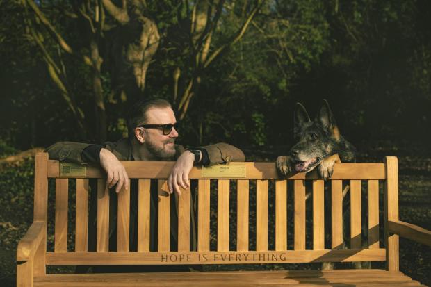 Undated handout photo issued by Netflix of Ricky Gervais and Brandy by a bench, Netflix has donated 25 benches to local councils around the UK as part of a mental health initiative celebrating the launch of the new series of Ricky Gervais' After Life.