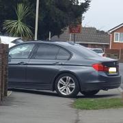 A BMW parked right across the pavement in Hawne Lane, Halesowen