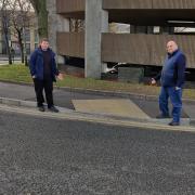 Cllr Simon Phipps and cllr Peter Dobbs with a new dropped kerb outside Halesowen Leisure Centre