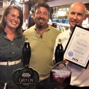 Licensees Phil and Eva Hardingham and CAMRA Branch Chairman, Tim Cadwell