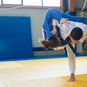 Photo by Kampus Production: https:a judoka throwing an opponent to the ground
