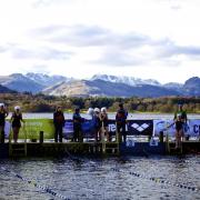 Swimmers chilling in the Lake District