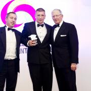 THE APPRENTICE: Charlie Holloway receiving his county award from a sponsor from Morgan Motor Co and Nick Hewer.
