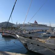 Cruise ship Boudicca alongside smaller sailing boats at Cartagena, Spain