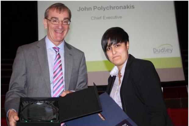 Rachel receiving a previous apprentice of the year award from former Dudley Council chief executive John Polychronakis.